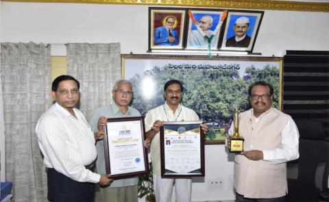 Life Service Award to Red Cross Society District President Lion Nataraj" -District Collector S Venkata Rao congratulated