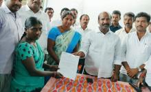 MLA Chirumurthy who handed over the LVOC cheque