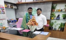 Vasvik Foundation members presented a bouquet to Health Director Srinivasa Rao...